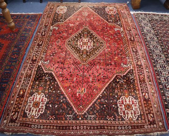 A Persian Abadeh design red, blue and ivory rug with animal and tribal motifs 240 x 170cm